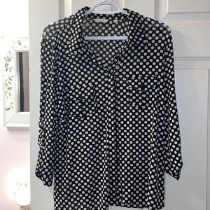 Women’s lovely polka dot blouse with double breast pockets.  Button up sleeves.